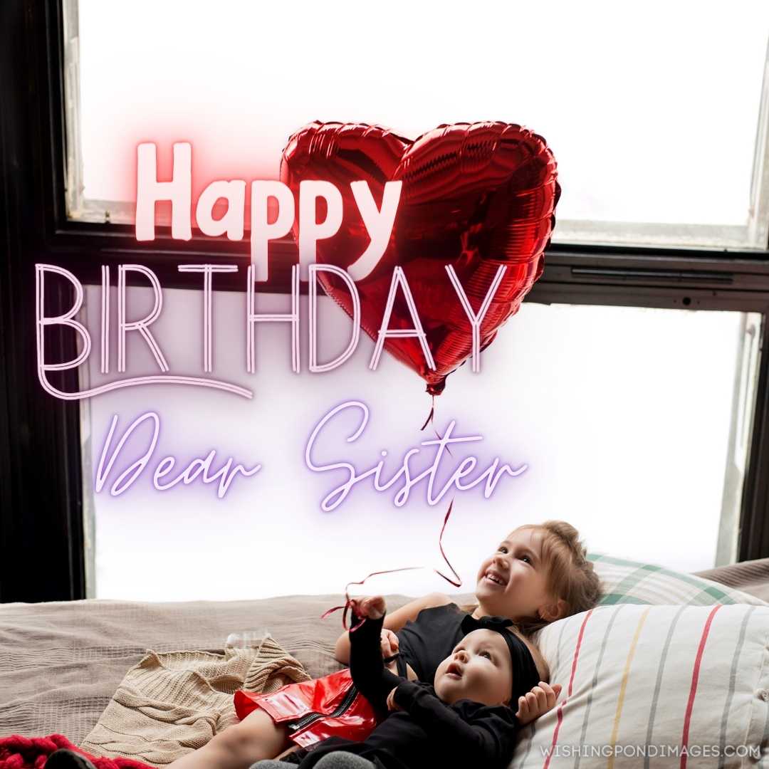 Two sisters hold a heart-shaped balloon in their hand. Happy Birthday Sister Images